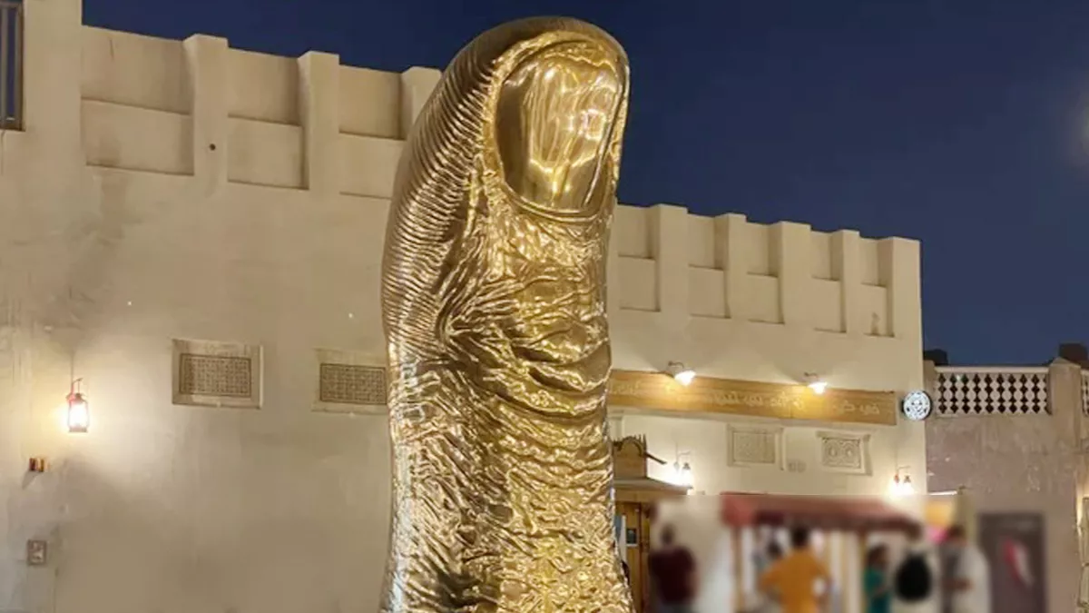The Golden Thumb Statue 5